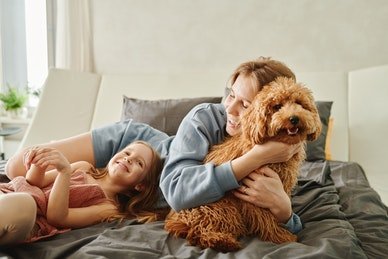 A woman with a child holding their hold | Spyglass Realty