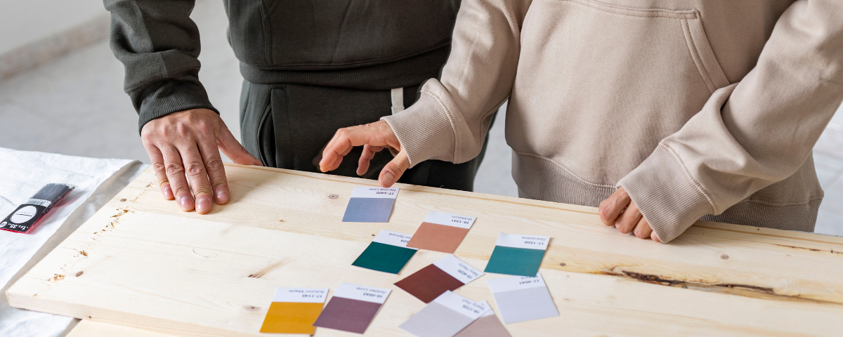 two people deciding on color finishes for a home
