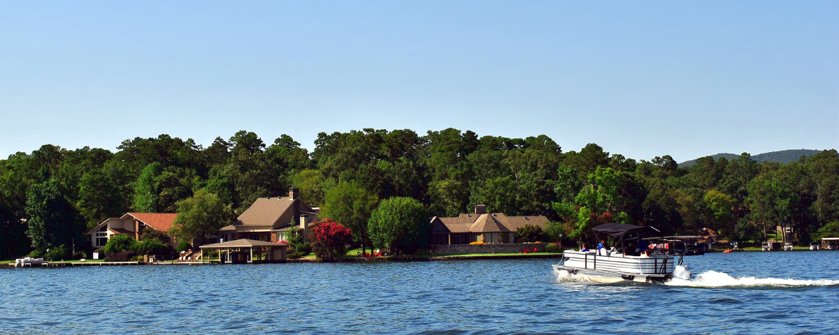 image of a boat sailing on a lake